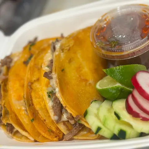 Birria tacos with consomé